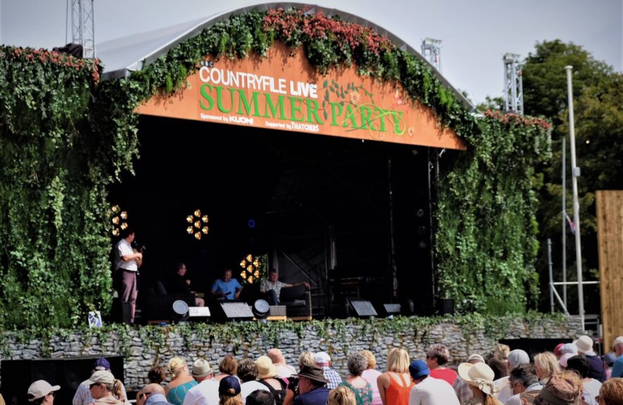 Artificial ivy walls for hire, framing the 'Countryfile Live Summer Party' stage with a stone-effect wall and crowd