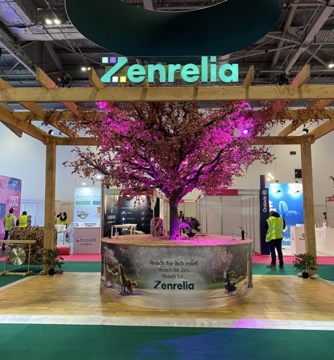Artificial pink cherry blossom tree for hire, in the centre of a pergola-covered Zenrelia stand at the London Vet Show